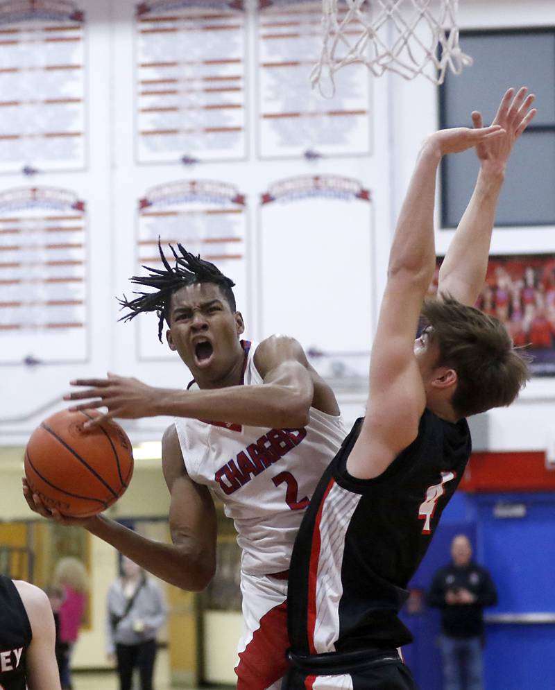 Dundee-Crown's Kali Freeman drives to the basket against Huntley's Ian Ravagnie during a Fox Valley Conference boys basketball game Tuesday, Feb. 14, 2023, at Dundee-Crown High School in Carpentersville.