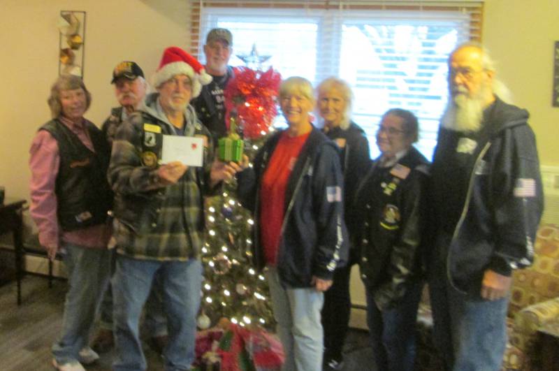 Pictured are American Legion Riders Post #181 from Sandwich members Linda and Cliff Oleson, Bill Kolb, Bob Mauer, Sandy Lawrence, Cherie Mauer, Sally Kolb and Bob Lawrence with gift cards to present to the residents at Countryside Village in Plano.