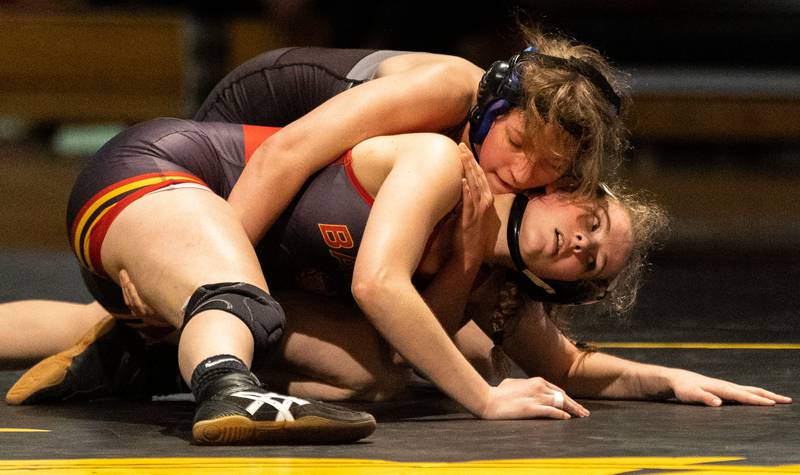 Lincoln Way’s Ella Giertuga (back) takes down Batavia’s Lizzy Beling during a varsity wrestling dual at Batavia High School on Friday, Jan. 10, 2025.