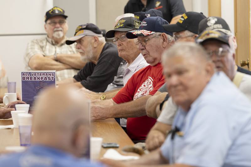 Mike Terveer (in red) meets with veterans during a breakfast at the Whiteside County Senior Center. Terveer is chairman of the Whiteside County Honor Flight.