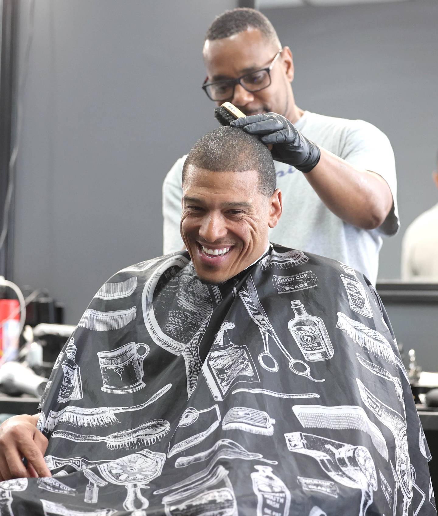 Newly elected DeKalb Ward 7 Alderman John Walker gets a hair cut from Lyndon Gay and talks about his first month as an alderman Thursday, June 1, 2023, at Roc's Barber Shop in DeKalb.