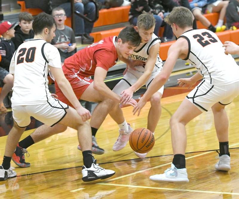 Oregon's Jacob Vegliando (11) fights for a loose ball between three Byron players during a Friday, Jan. 20 Big Northern Conference game in Byron.