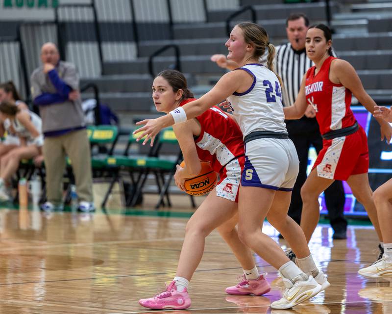 Audrey Arambula (5) of Streator holds ball as Anna Hjerpe (24) of Serena defends on Monday, November 17, 2025 at Seneca High School in Seneca.