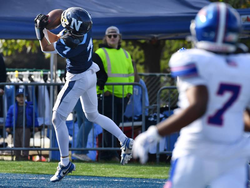 Nazareth's Jake Cestone (left) makes an over the shoulder catch for a touchdown during a Class 5A second round game against Glenbard South on Nov. 4, 2023 at Nazareth Academy in LaGrange Park.