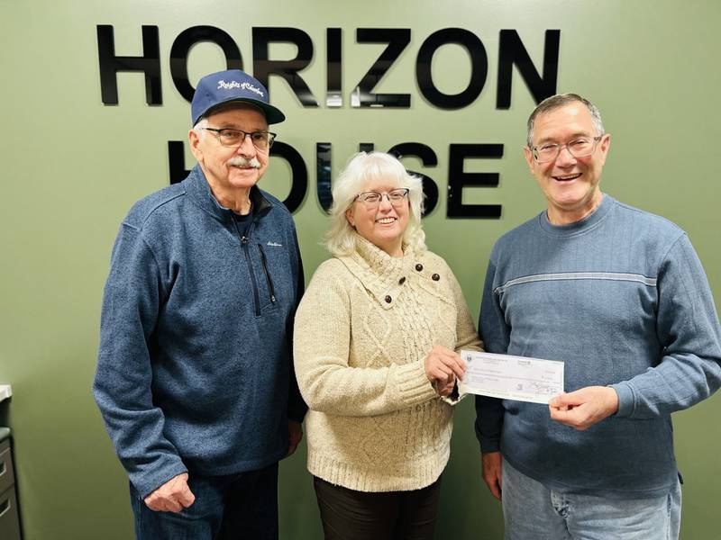 Michelle Rich, center, CEO of Horizon House, accepts a $2,482.55 donation from Granville Knights of Columbus co-chairmen Doug Ossola, left, and Chuck Loebach. The funds were raised through the organization's Tootsie Roll fundraiser.