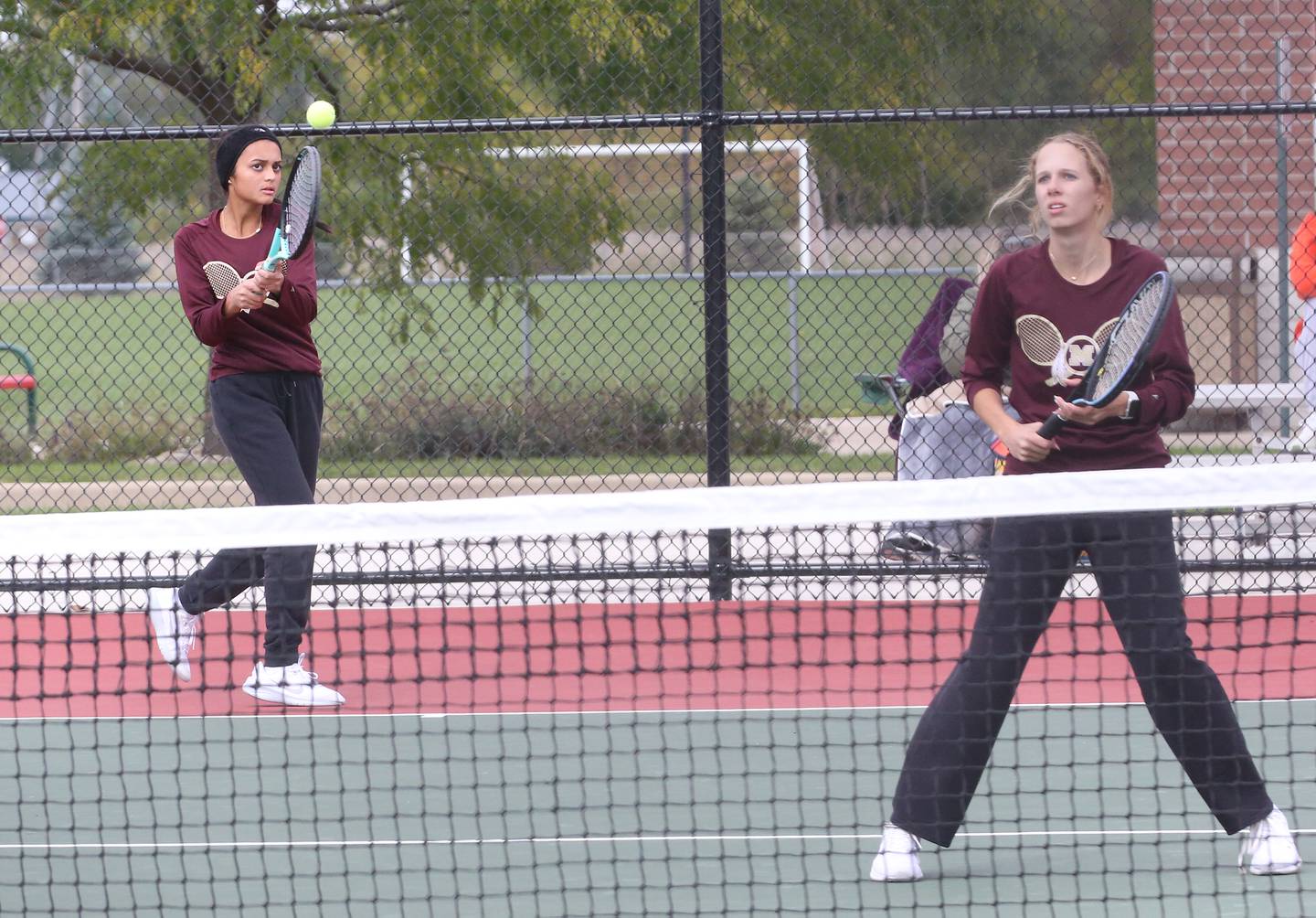 Morris doubles team members Shreya Patel and Meghan Bzdill play the Ottawa doubles team of Rylee O'Fallon and Emma Cushing in the semifinals of the Class 1A Sectional tennis meet on Monday, Oct. 16, 2023 at the La Salle-Peru Sports Complex in La Salle.