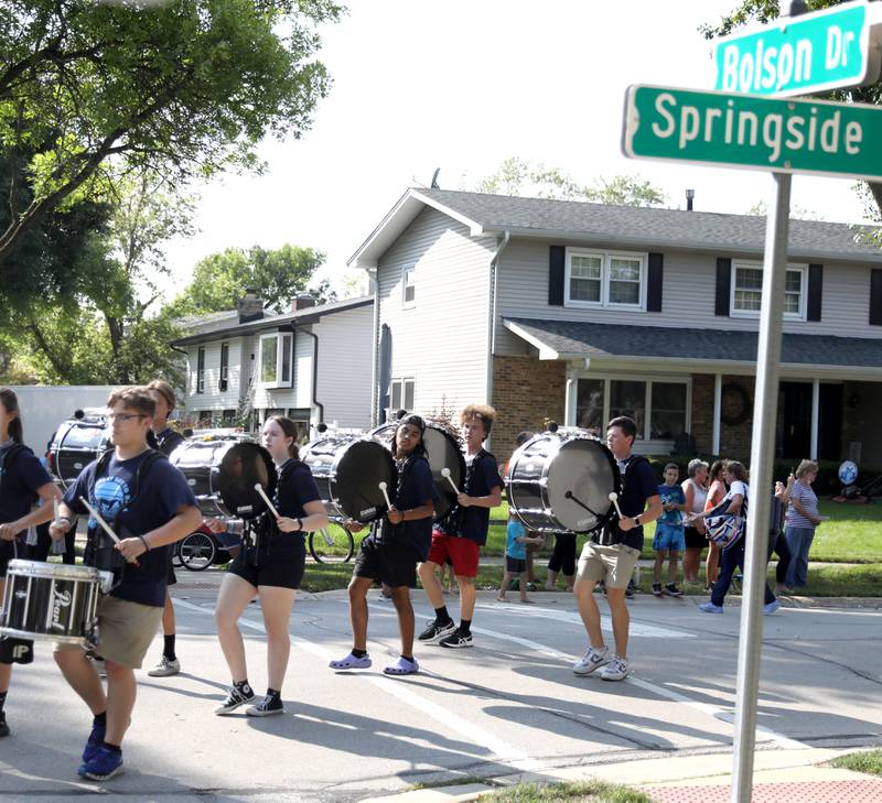 Members of the marching band perform in the Downers Grove South Homecoming parade on Friday, Sept. 16, 2022.