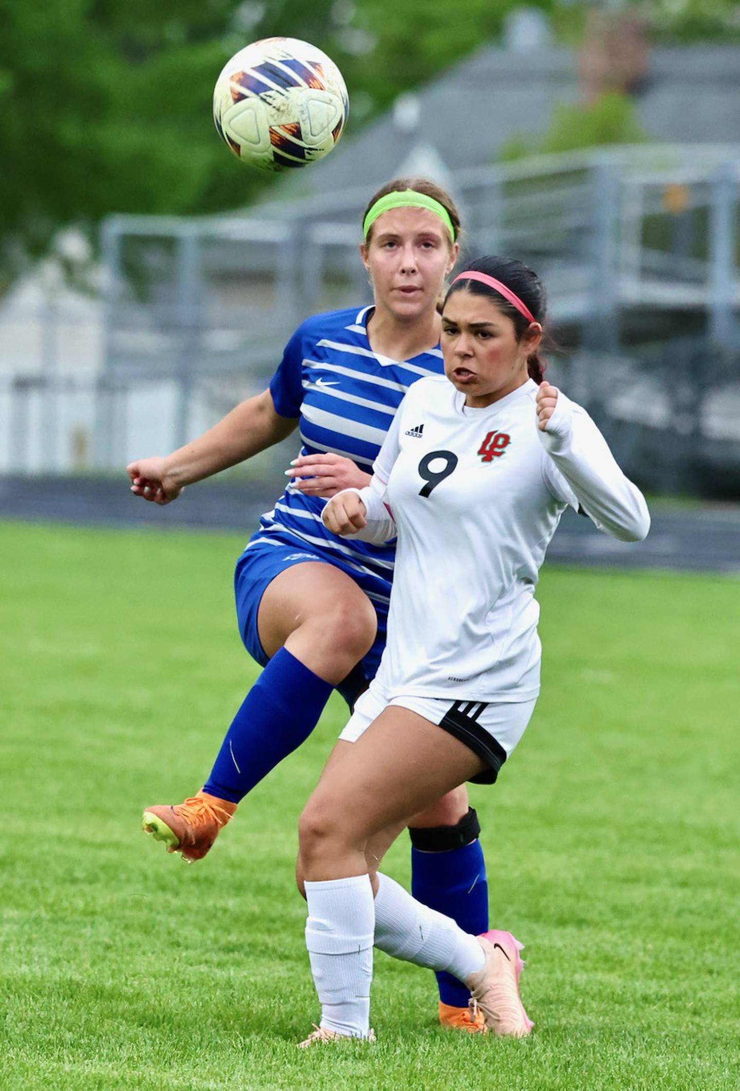 L-P's Sofia Nanez (9) and Princeton's Ava Kyle battle for the ball Thursday night at Bryant Field. he Tigresses won 4-1.
