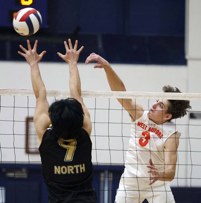 West Aurora’s Tucker Dickson, (3) pushes the ball past Glenbard North’s Joshua Mejia (9) during the West Aurora Blackhawk Invite boys volleyball tournament Saturday, April 5, 2025 in Aurora Ill.