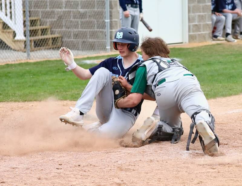 Bureau Valley's Brock Foster scores the game-tying run in the seventh inning on a sac fly by Sam Rouse. Foster had a key two-run triple.