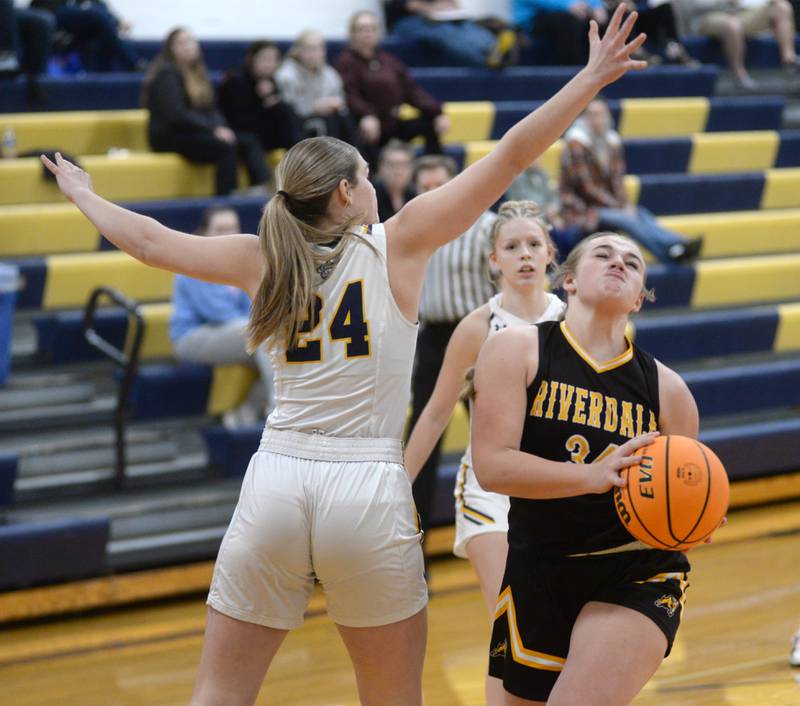 Riverdale's Brooklyn Peterson drives to the basket as Polo's Katelyn Rockwood defends during a Saturday, Jan. 18, 2025 game at Polo High School.