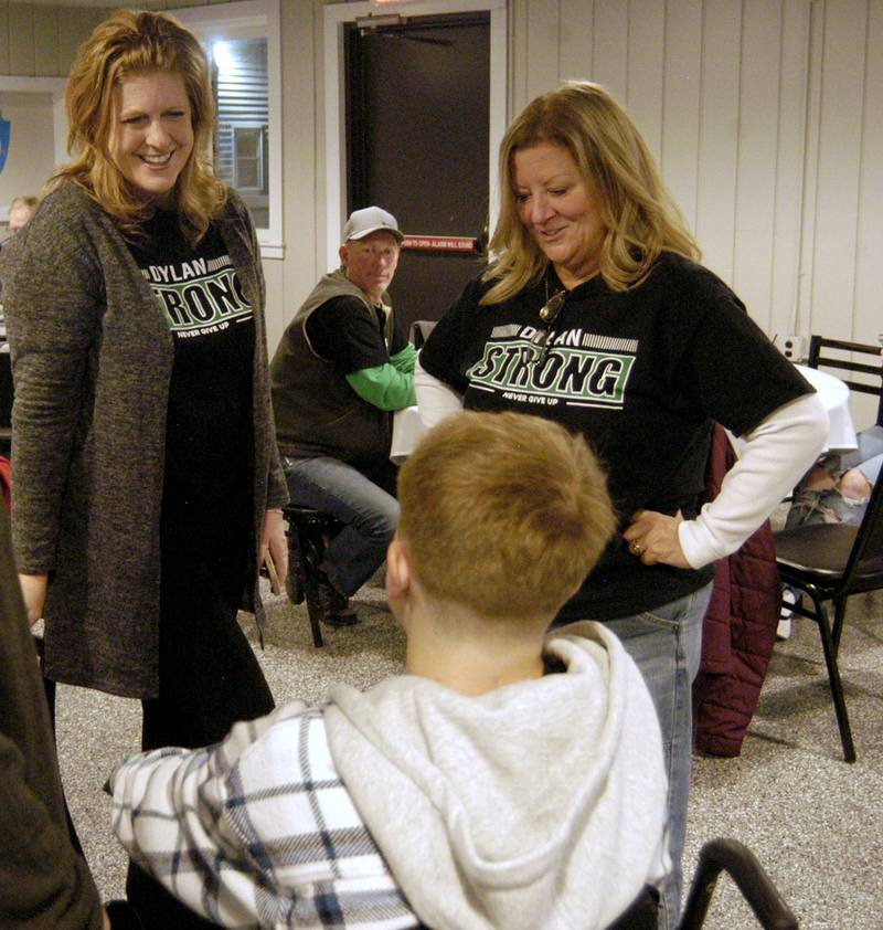 Nicol Wescott, Dylan's mother, and his aunt Kim Kilday talk with Dylan Wescott at his Welcome Home Party at Emerson's Pub on Saturday, Nov. 22.