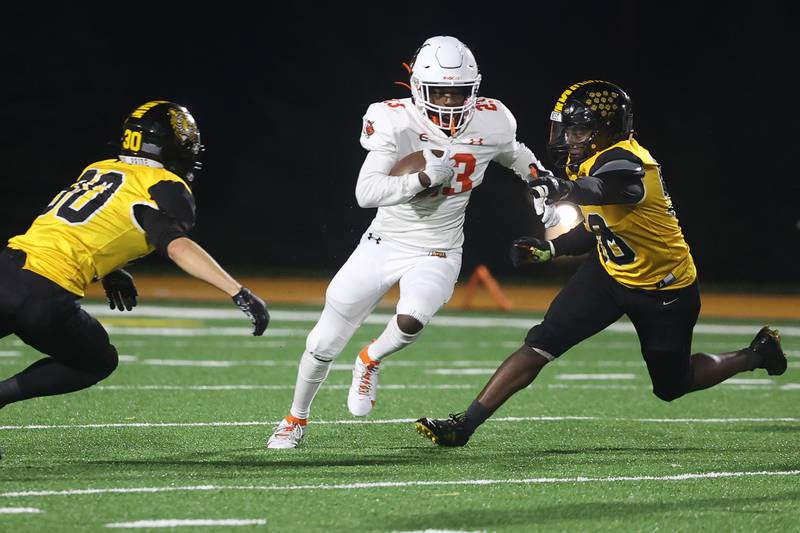 Plainfield East’s Noah McConico finds a hole for a run against Joliet West on Friday, Oct. 13, 2023 in Joliet.