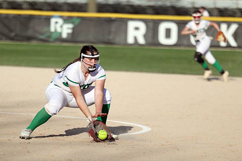 Rock Falls’ Katie Thatcher scoops up a ball against Dixon Tuesday, April 11, 2023.