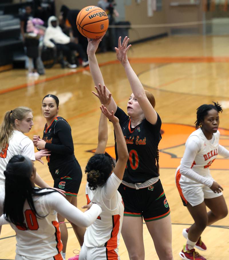 Plainfield East's Heather Bunker shoots over DeKalb's Nazeria Dean Thursday, Feb. 12, 2026, during their game at DeKalb High School.