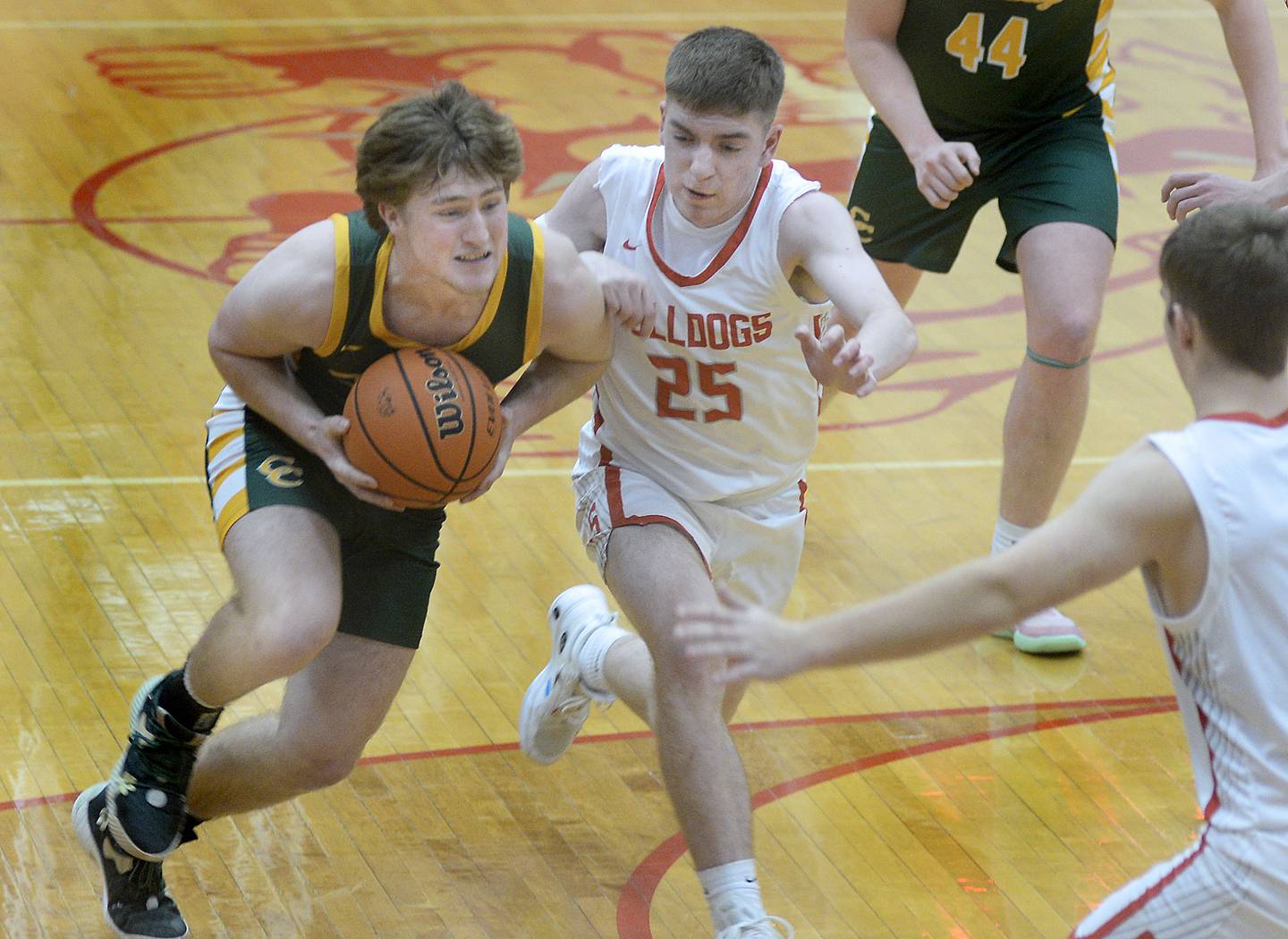 Coal City’s Carson Headley works to get to the basket past Streator’s Cade Peterson in the 2nd period on Tuesday, Jan. 31, 2023 at Streator High School.