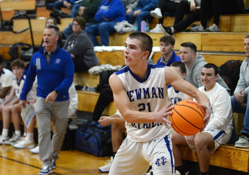 Newman's Cody McBride (21) looks to pass against Marengo on Friday, Nov. 29, 2024 at the Oregon Thanksgiving Tournament held at the Blackhawk Center in Oregon.