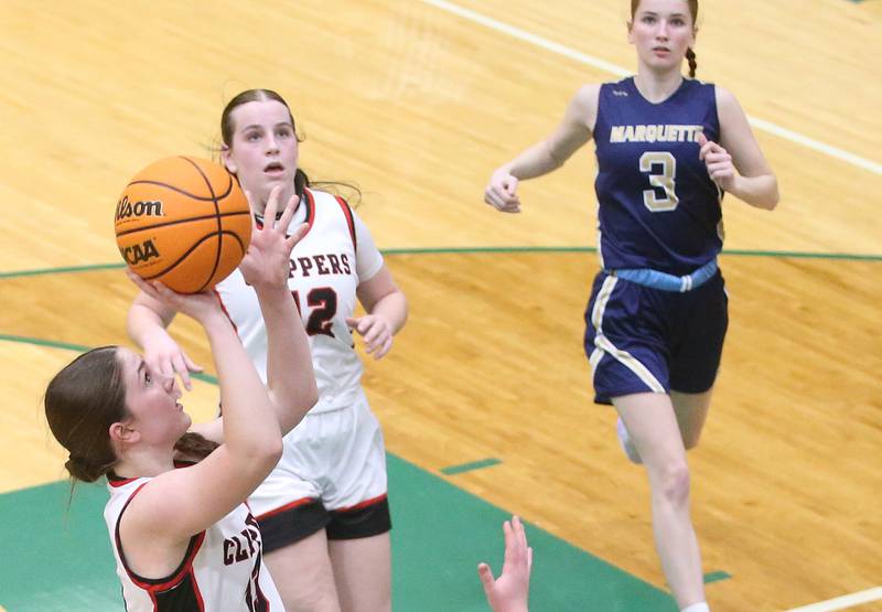 Amboy/Ohio's Ellie McLaughlin shoots a jump shot as Marquette's Mogan Nelson arrives late to the play during the Class 1A Regional championship on Thursday, Feb. 20, 2025 at St. Bede Academy.