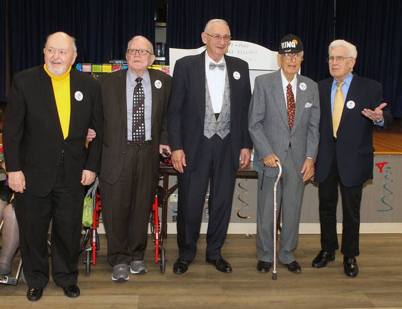 Bob Anderson (second from right) stands with Fred Hoffmann, Ed Wirtz, Thomas Stasiak and Hank Hoes after being crowned, Prom King, during the Senior Prom to celebrate the 50th Anniversary of Leisure Village in Fox Lake.