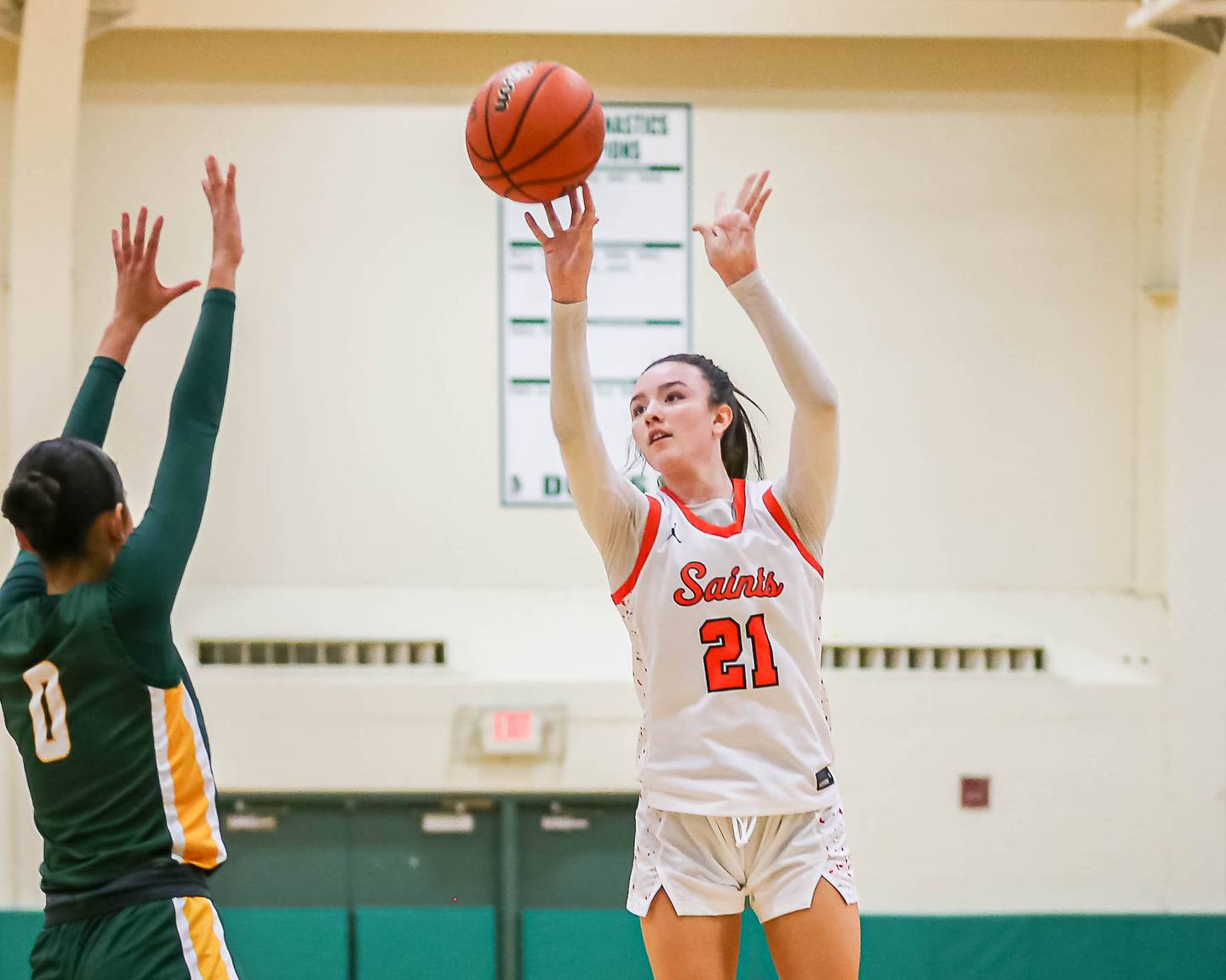 St Charles East's Sofia O'Sullivan (21) shoots a jumper during their York Thanksgiving Tournament game between St Charles East at Waubonsie Valley on Monday, Nov 18, 2024  in Elmurst.