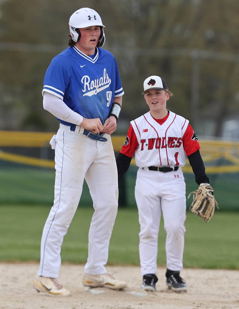 Indian Creek's Noah Fenske (right) talks to Hinckley-Big Rock's Martin Ledbetter at second base during their game Monday, May 1, 2023, at Indian Creek High School in Shabbona.