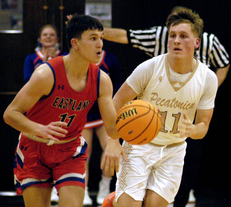 Eastland's Maddox Spears gets the ball up court with defender Dylan Evans in pursuit. The Eastland Cougars faced the Pecatonica Indians in Friday’s Class 1A Orion Sectional final at Orion High School on March 6, 2026. Eastland won the game 48-41.