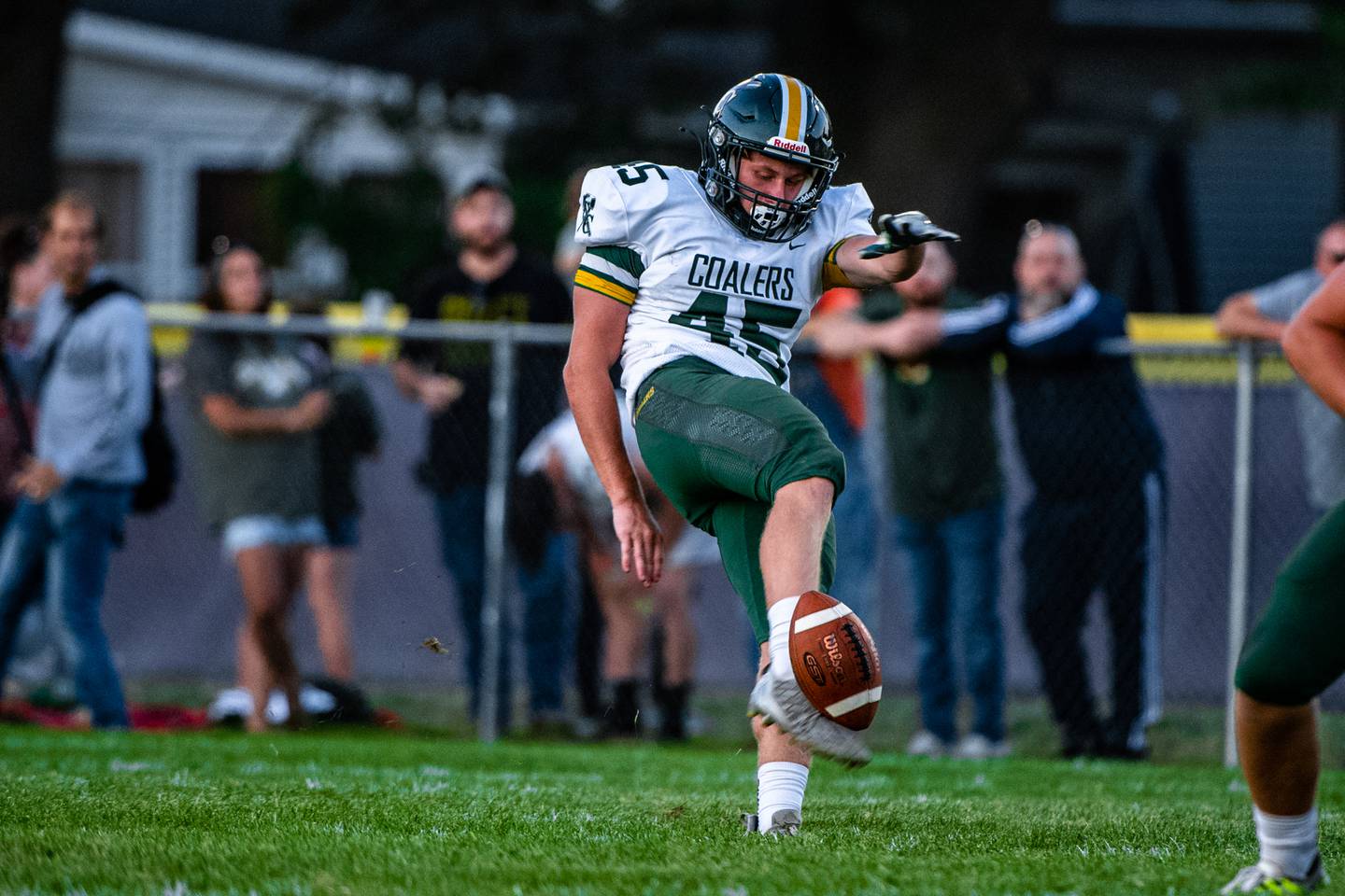 Coal Citys Landin Benson punts the ball during a game against Wilmington  Friday, Sept. 9, 2022 ,at Wilmington High School