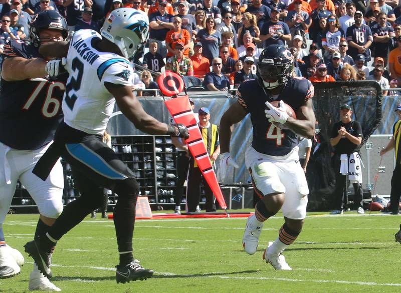 Chicago Bears running back D'Andre Swift eyes the end zone as teammate offensive lineman Teven Jenkins pushes Carolina Panthers cornerback Mike Jackson away from the play on Sunday, Oct. 6, 2024 at Soldier Field in Chicago.