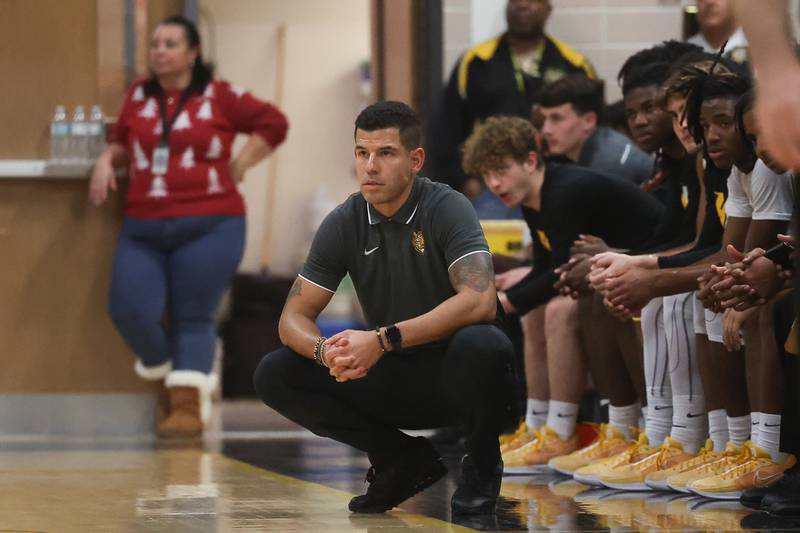 Joliet West head coach Jeremy Kreiger keeps an eye on the game against Plainfield East on Friday, Dec. 8th, 2023 in Joliet.