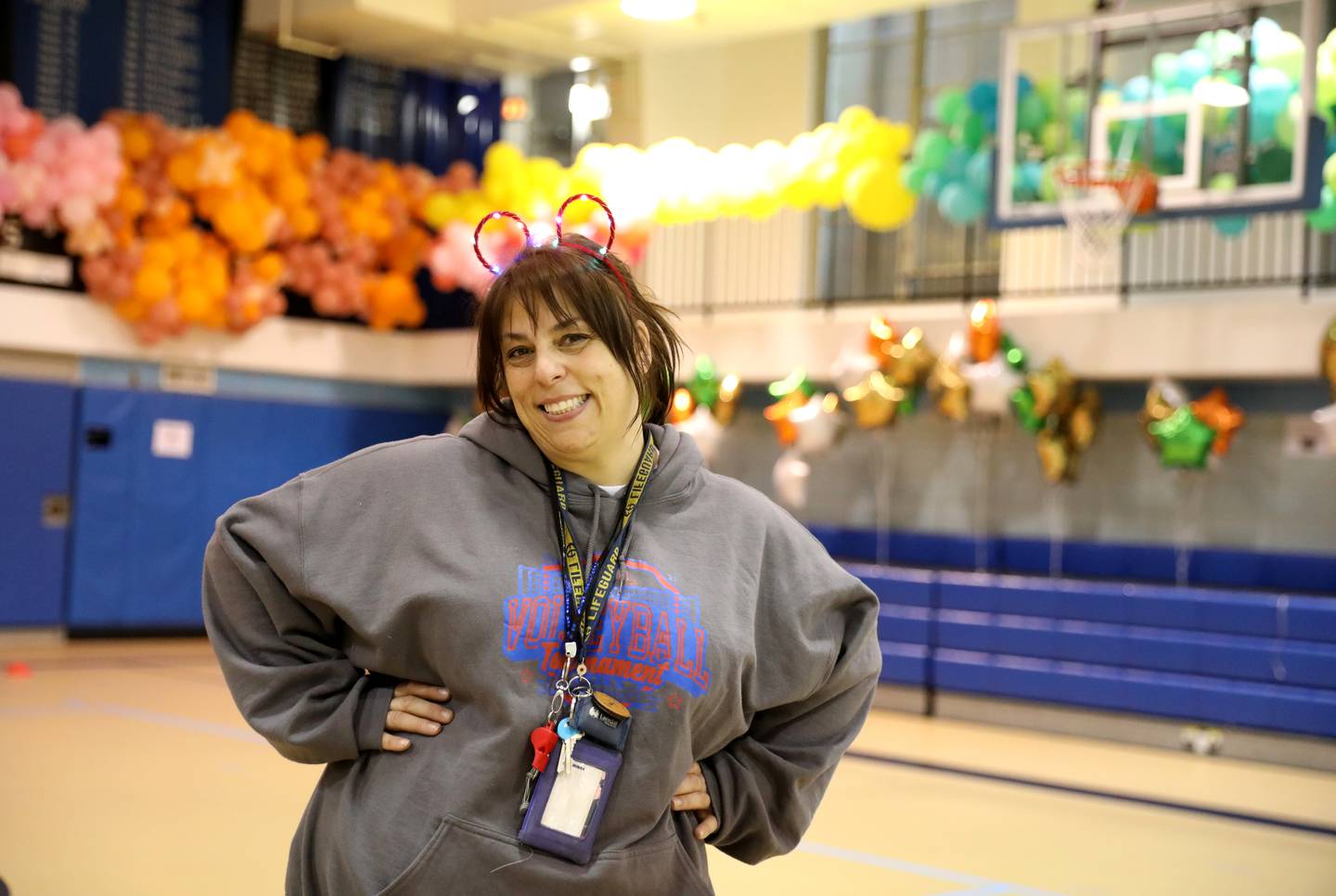 Physical education teacher Christine Giunta-Mayer laughs and dances with her students at St. Petronille Catholic School in Glen Ellyn.