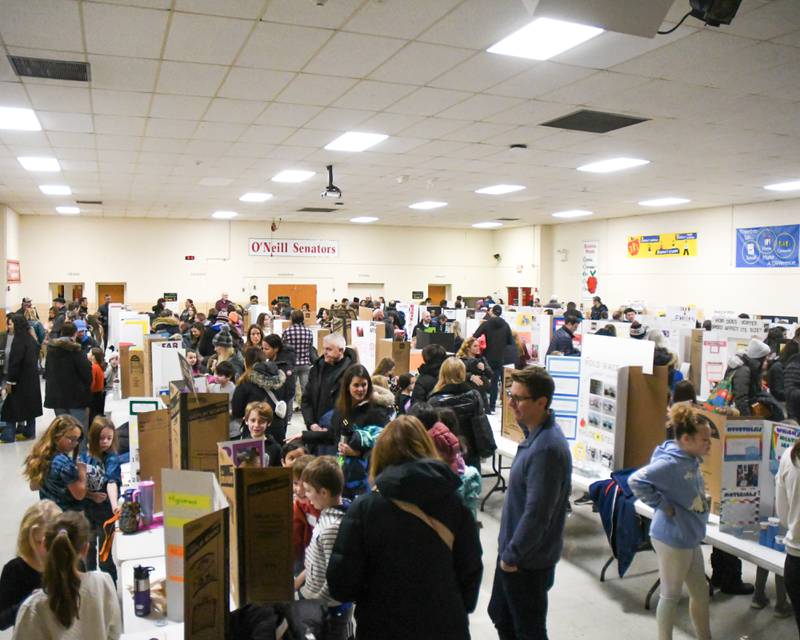 Families and young scantest pack the gym of O'Neill Middle School in Downers Grove on Saturday Jan. 20, 2024, during a science fair.