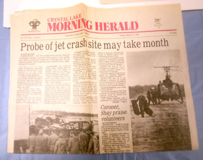 Morning Herald news clippings are displayed as a remembrance was held Saturday at Wonder Lake Fire Protection District Station 2 on the 40th anniversary of a midair military jet explosion that happened over the small, rural area northeast of Woodstock. The plane exploded midair at 9:11 p.m. on March 19, 1982, its flaming pieces raining over a 2-mile area near Greenwood. On board were more than two-dozen members of the Air Force Reserve and Air National Guard. Twenty-seven people died.