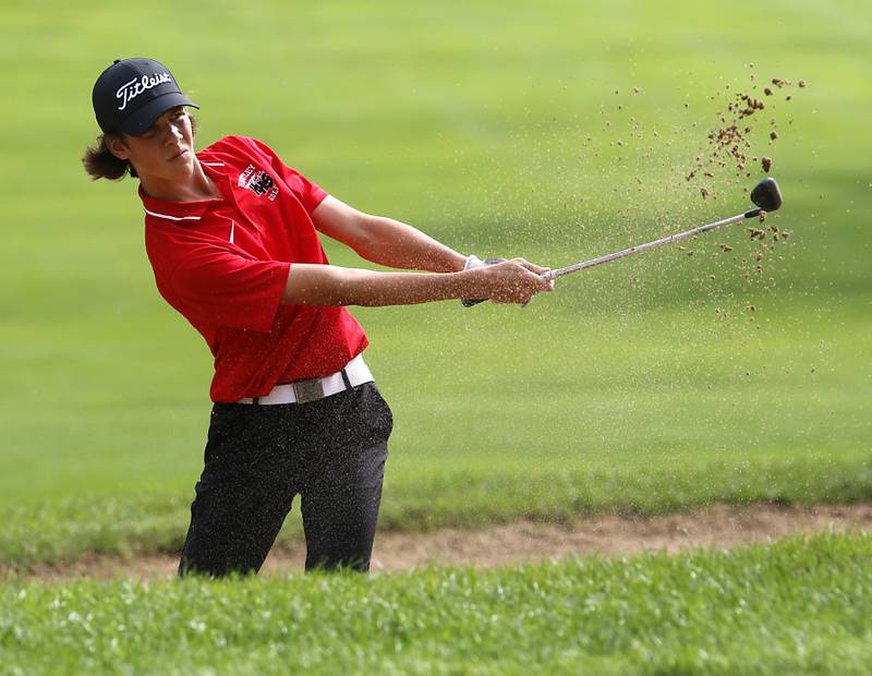 Huntley’s Nathan Elm hits out of the sand trap on the seventh hole during the Fox Valley Conference Boys Golf Tournament Thursday, Sept. 21, 2023, at McHenry Country Club in McHenry.