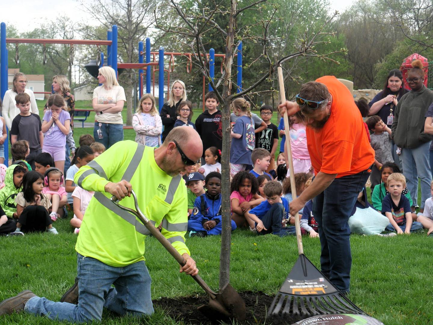 The DeKalb Public Works team finishes planting a tree at Lincoln Elementary School on Arbor Day on Friday, April 24, 2026.