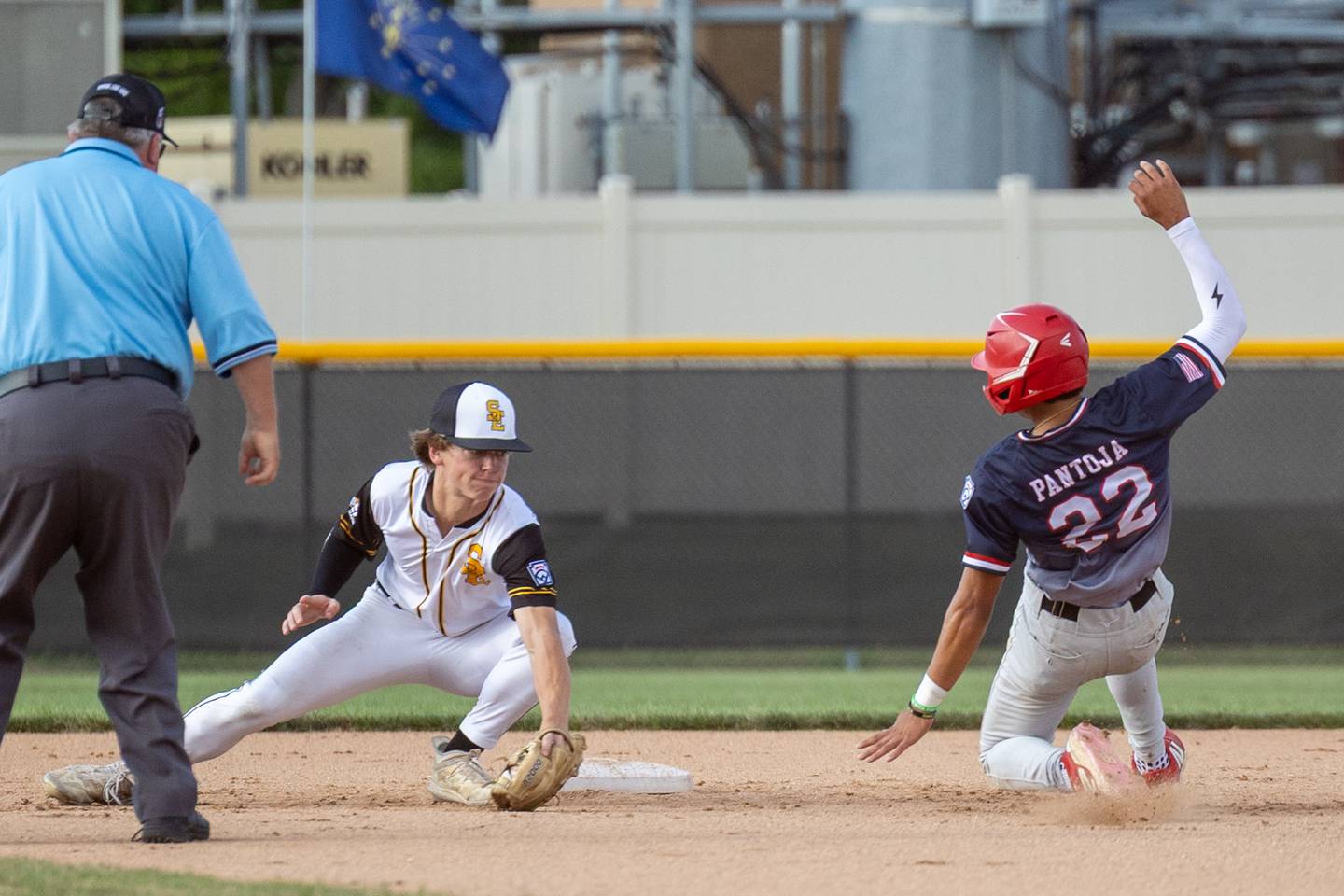 Adan Pantoja of Illinois District 20 slides into second base as Chase Keizer attempts to tag him out on Saturday, July 12, 2025 at Washington Park in Peru.