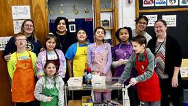 Sterling elementary students' coffee cart rolls snacks, smiles to classroom doors