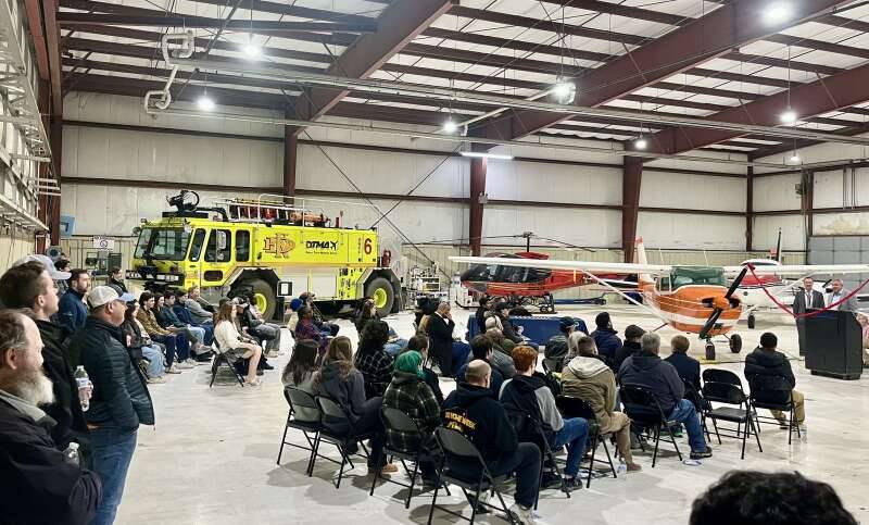 DeKalb Mayor Cohen Barnes addresses people from as far away as Minnesota at the Jan. 18 announcement of the Illinois Aviation Academy's new pilot training program at the DeKalb Taylor Municipal Airport. Robert Werderich, Illinois Aviation Academy campus president and executive vice president of flight operations for Spartan Education Group, joins Barnes at the podium. (Photo provided by Illinois Aviation Academy through the Daily Herald)