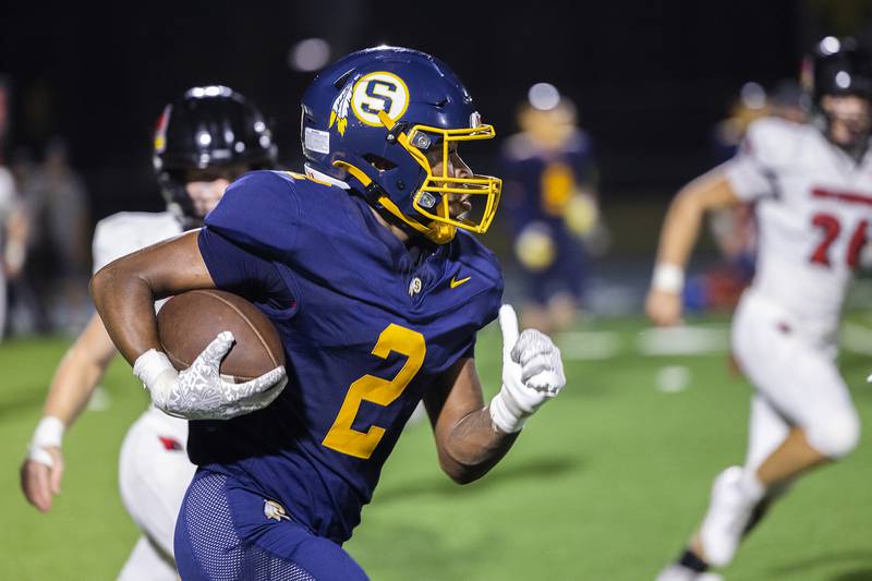 Sterling’s Kaedon Phillips picks up yards against Metamora Friday, Aug. 30, 2024 at Sterling High School.