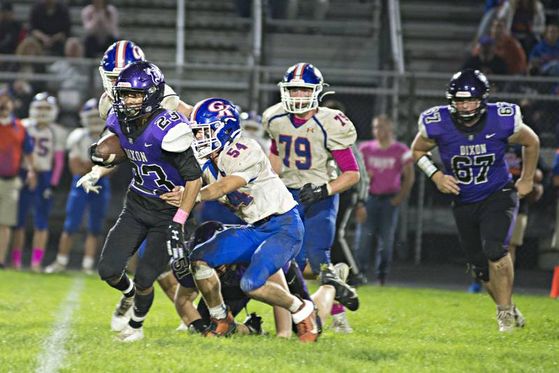 Dixon's Zavion Johnson runs hard against the G-K defense Friday, Oct. 8, 2021.