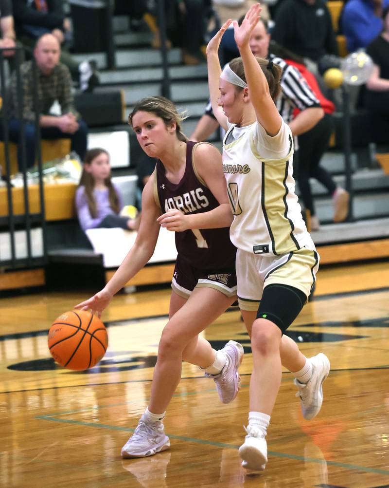 Morris' Cami Pfeifer goes to the basket against Sycamore's Cortni Kruizenga during their game Tuesday, Jan. 13, 2026, at Sycamore High School.