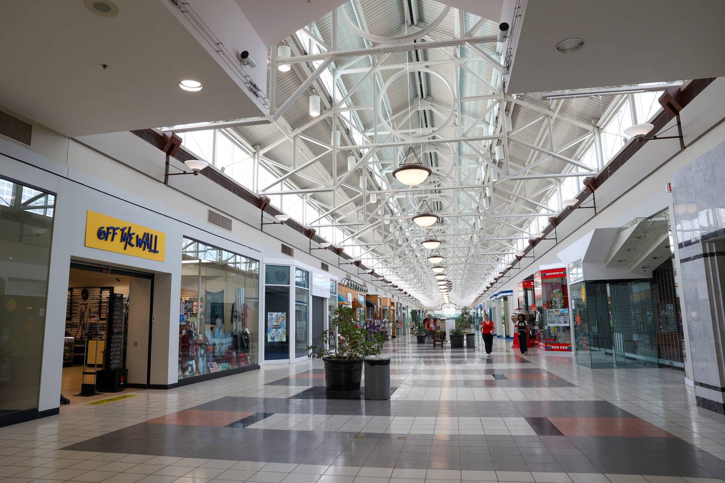 People walk the main hallway, also called the "spine," of the Northfield Square mall on Wednesday, July 16, 2025, as the current vendors are open for the day.