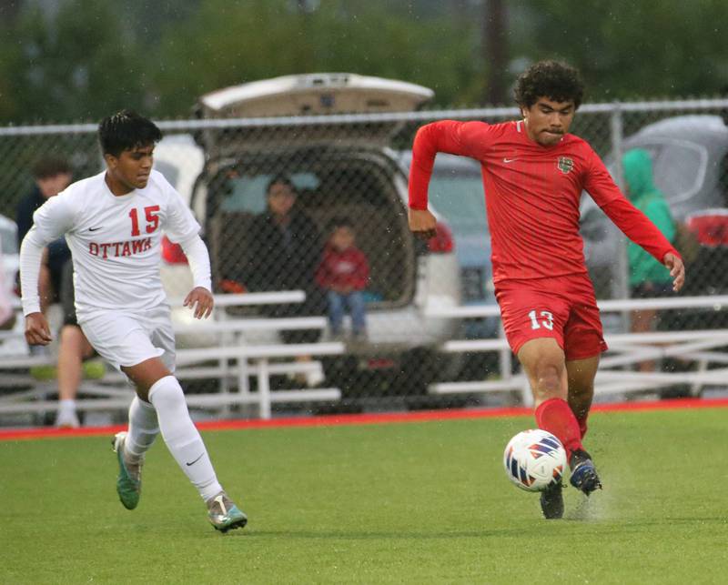 L-P's Christopher Antoine kicks the ball ahead of Ottawa's Michael Bedolla on Monday, Sept. 11, 2023 at the L-P Athletic Complex in La Salle.