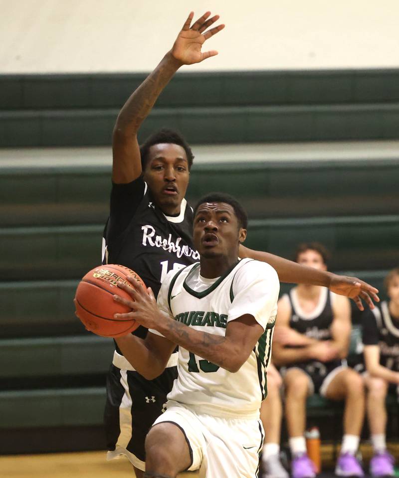 Kishwaukee College's Carron Gibson shoots in front of Rockford University's Isiah Stokes Thursday, Jan. 22, 2026, during their game at Kishwaukee College in Malta.