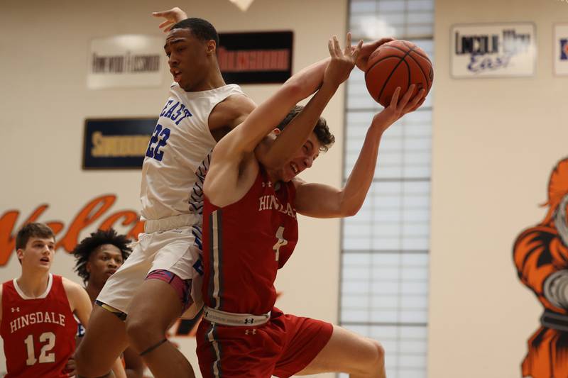 Hinsdale Central’s Chase Collignon draws the foul from Lincoln-Way East’s Kyle Olagbegi going for the rebound in the Lincoln-Way West Warrior Showdown on Saturday January 28th, 2023.