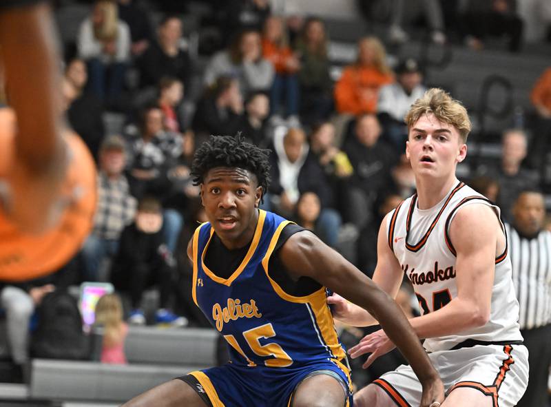 Joliet Central's James Lee (15) positioning for a pass during a conference game against Minooka on Friday, Jan. 10, 2025, at Minooka.