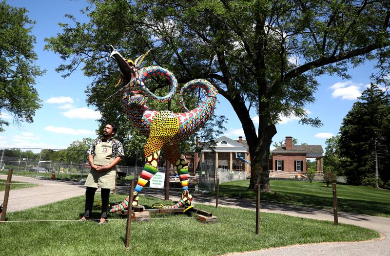 Artist Emanuel Arturo Zárate Ortíz talks about one of his pieces as part of “Alebrijes: Creatures of a Dream World.” The Cantigny Park outdoor art exhibit featuring dozens of imaginary creatures inspired by Mexican folklore is on display through October in Wheaton.