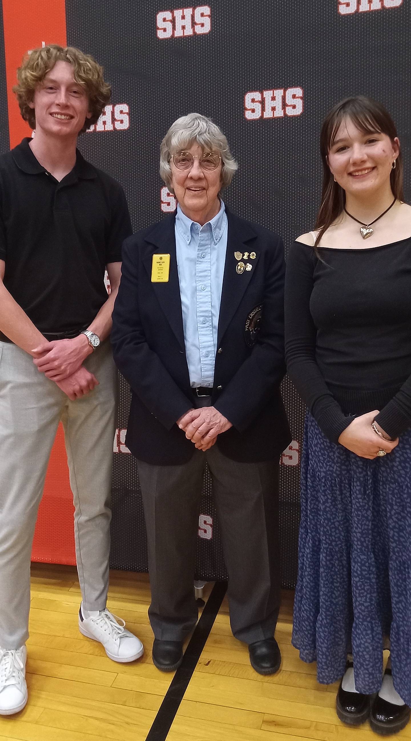 Sandwich Lions Club President Nancy Rex stands with Max Cryer (left) and Ashlyn Strenz, two Sandwich High School graduates awarded the 2024 Lou Brady Scholarships.