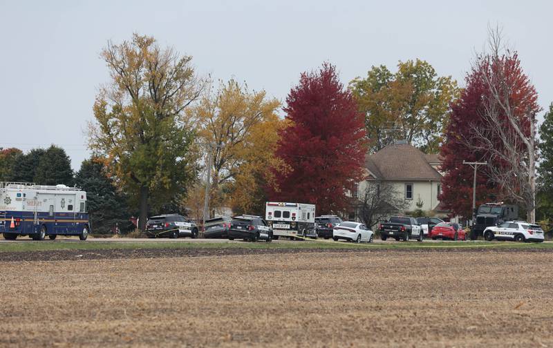 DeKalb County sheriff's deputies and law enforcement authorities investigate the scene of a fatal police shooting on Wednesday, Oct. 23, 2024 on Rich Road just west of Nelson Road in DeKalb Township. A man was shot and killed by police after an hours-long standoff involving a hostage. The man allegedly fired multiple rounds at officers, who returned fire, authorities said.
