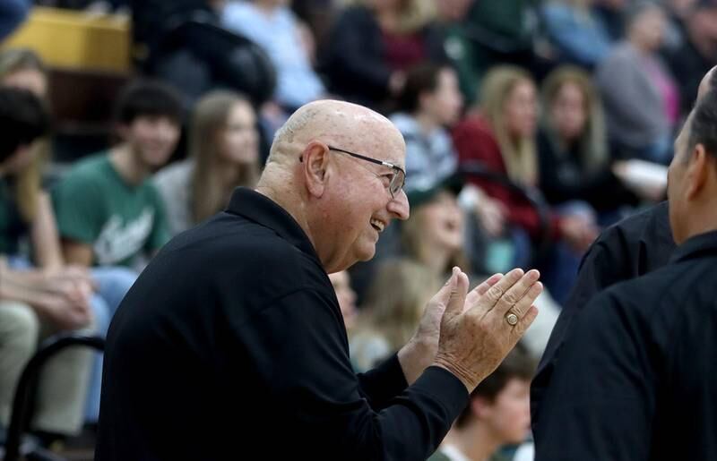 Jim Hinkle shares a laugh with others before the title game of the Hinkle Holiday Classic Basketball Tournament at Jacobs High School Friday.