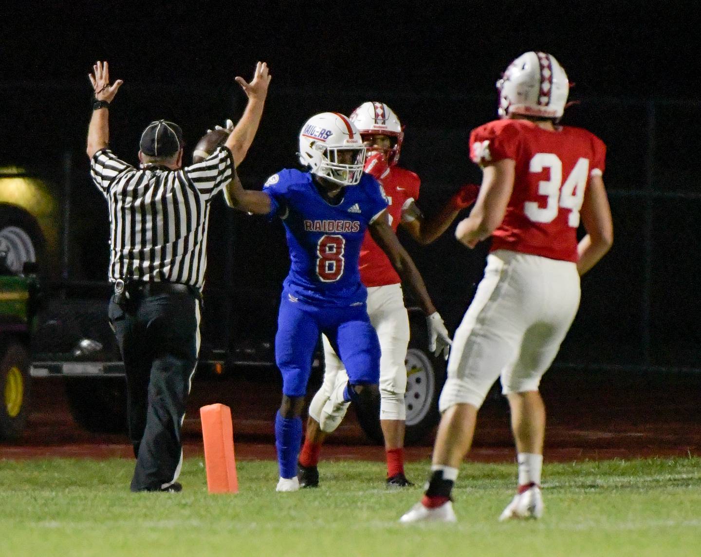 Glenbard South's Cam Williams (8) celebrates his late second quarter touchdown against South Elgin on Friday, September 10, 2021.